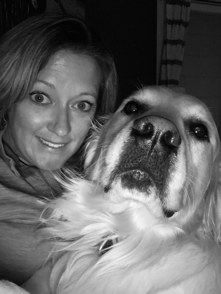 Natalie, owner of Clean K9 Smiles, with her dog.